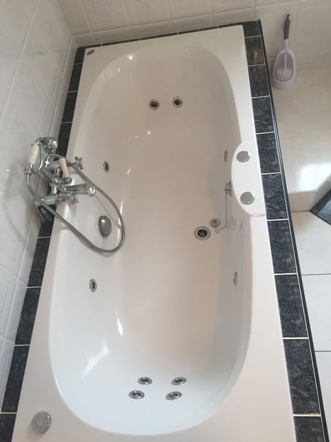 Jetted tub, hair dryer, towels, soap