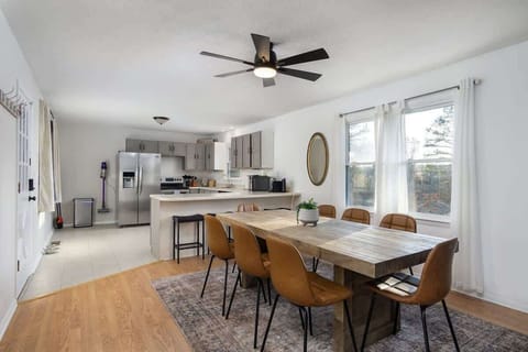 Dining table for 8 and 3 additional barstools in the kitchen