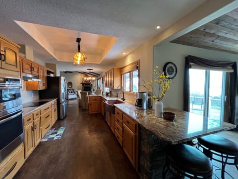 custom kitchen with granite countertops and copper sink!