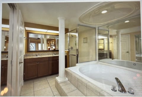 Combined shower/tub, jetted tub, hair dryer, towels