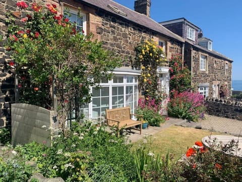 Lawned front garden and drive for two cars