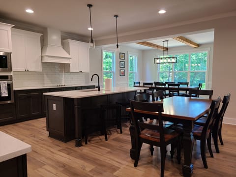 Great Room - kitchen table, dining table and bar stools seat 18 plus 6 on deck