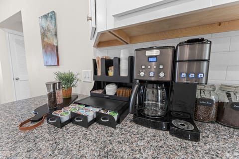 Custom coffee station with full selection of K-cups, whole beans, d-caff, sweeteners, creamer