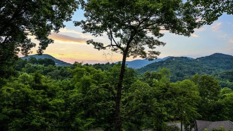 Enjoy a peaceful sunset over the mountains from your cabin's deck!