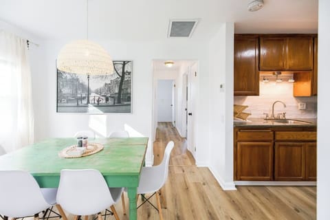 Dining room is between kitchen and living room. Table seats 6 comfortably.