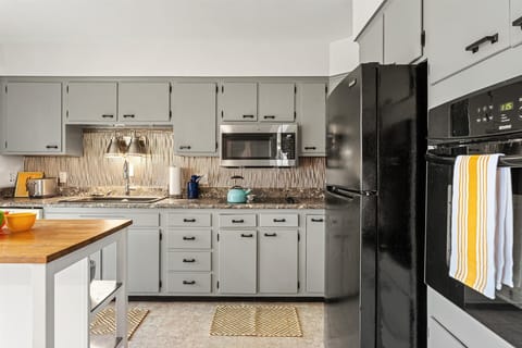 Spacious kitchen complete with modern appliances