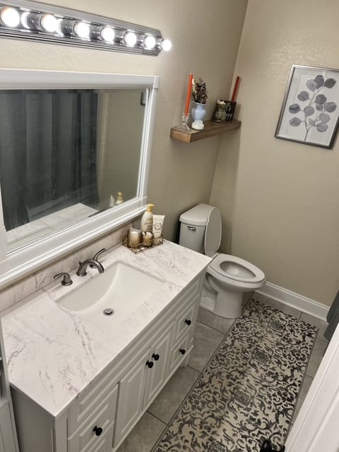 Combined shower/tub, hair dryer, towels, toilet paper