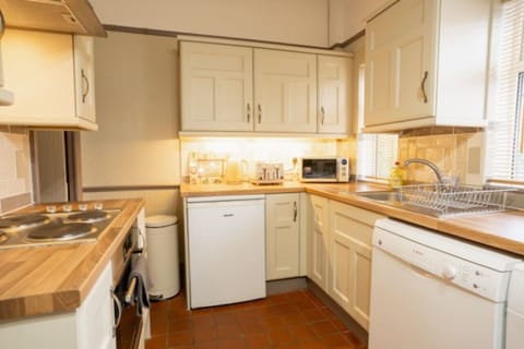 The Kitchen: the lovely shaker style kitchen comes well equipped with everything you need for a comfortable stay.