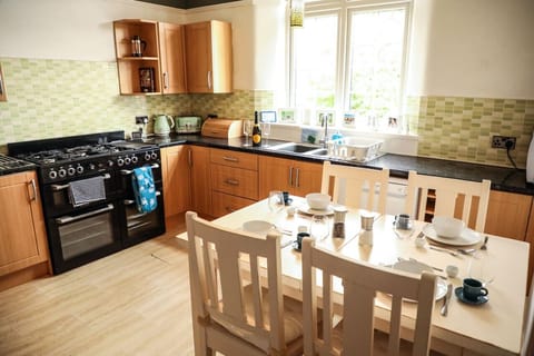 The Kitchen: the modern kitchen features new appliances and an additional dining table, making it great for preparing & enjoying breakfasts and informal suppers.