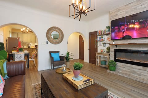The fireplace adds a warm focal point to the living room.