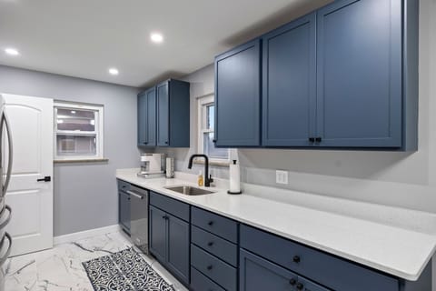 Fully equipped kitchen with dishwasher and appliances