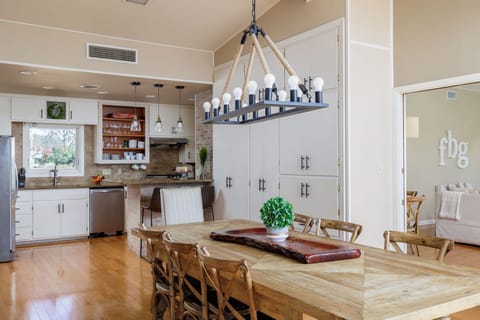 Enjoy memorable dining experiences in the welcoming ambiance of the dining area, featuring a beautiful wood table, stylish chairs, and plenty of natural light.