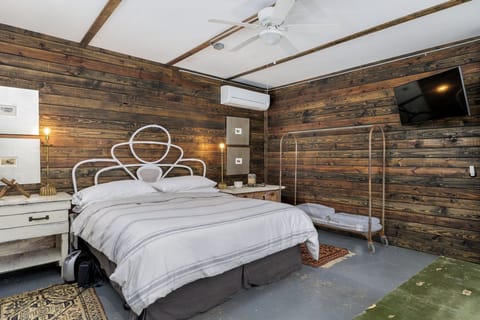 Retreat to the cozy ambiance of the master bedroom, furnished with a comfortable king-sized bed for a peaceful night's sleep.