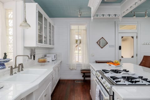 Experience the joy of cooking in our spacious kitchen, complete with a convenient island, stainless steel appliances, and all the tools you need to whip up delicious meals