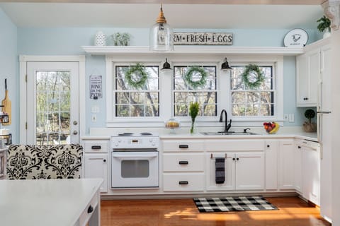 Gather around the heart of the home – the kitchen – where culinary delights come to life amidst a backdrop of warmth and hospitality