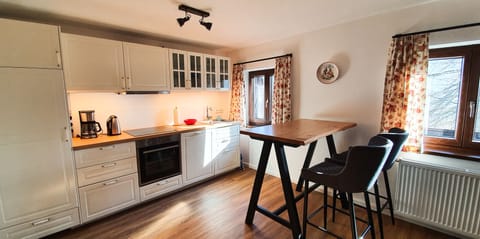 Fridge, stovetop, dishwasher, coffee/tea maker