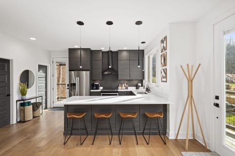 Fully stocked kitchen, including electric kettle, coffee maker, and coffee.