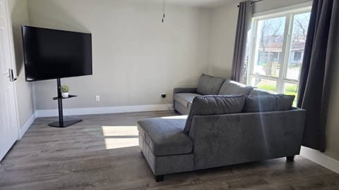 The living room is equipped with a television, providing a cozy space for guests.