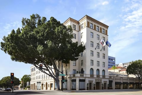 Arrive in style at an iconic, sunlit exterior facade.