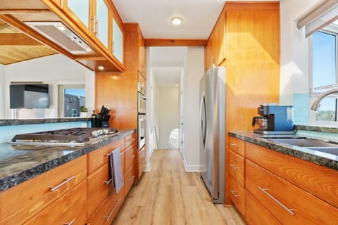 Savor the flavors of the coast in our fully stocked, stylish kitchen—where culinary inspiration meets sea views.