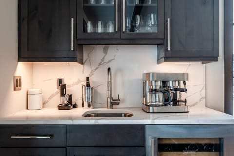 Bar with coffee maker and Subzero wine cooler