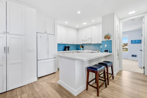 Whip up coastal feast in our fully-equipped kitchen, where function meets style.