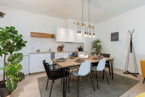 Open kitchen — elegant white design with natural accents.