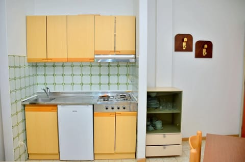 Fridge, stovetop, coffee/tea maker, cookware/dishes/utensils