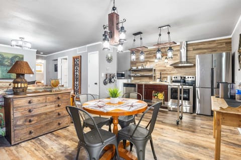 The cozy dining table in the Rustic Suite seats four, and it's conveniently located close to the kitchen, too!
