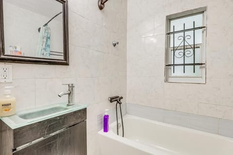 Bathtub, eco-friendly toiletries, towels, soap