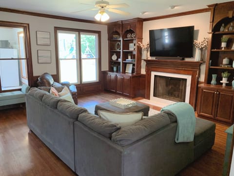 Another view of the living room with fireplace and TV