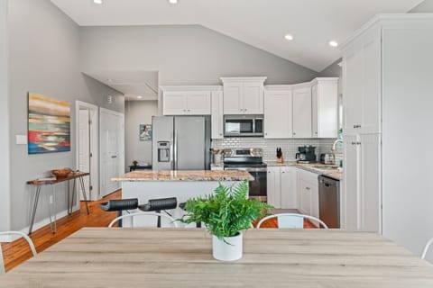 Very light and bright dining area looking into the kitchen.