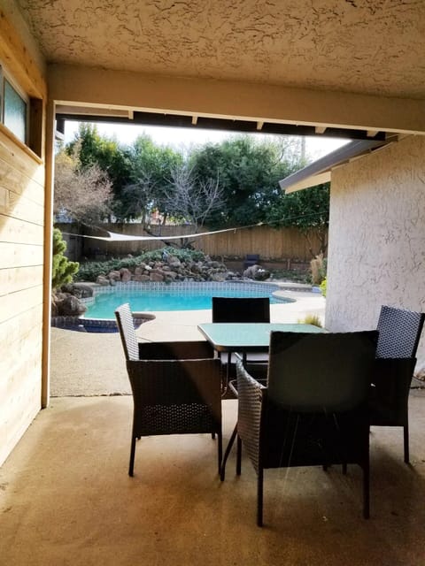 Have a nice drink and meal in the patio with a view of the pool