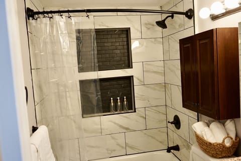 Combined shower/tub, hair dryer, towels, soap