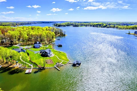 A breathtaking lakeside sanctuary offering stunning water views and direct access to aquatic adventures