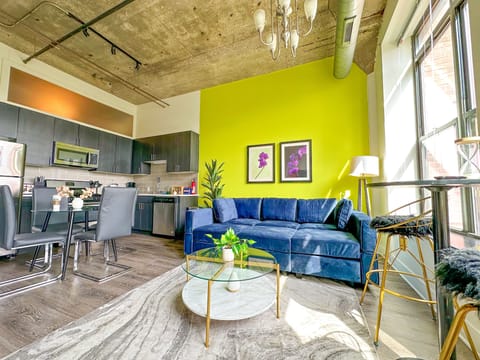 Spacious living room with a lot of natural light and large windows.