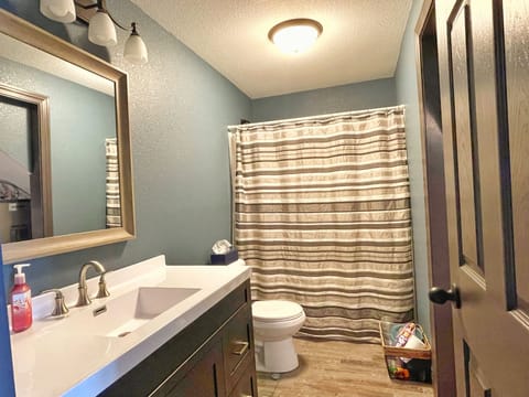 Combined shower/tub, hair dryer, towels, soap