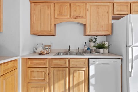 The fully equipped kitchen includes all dining and cookware provided.