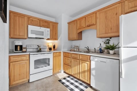 The fully-equipped kitchen is stocked with all the dining and cooking essentials you need.