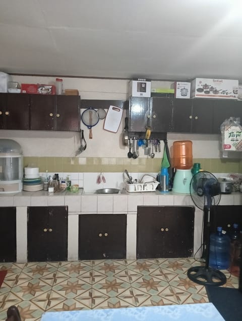 Fridge, stovetop, cookware/dishes/utensils, dining tables