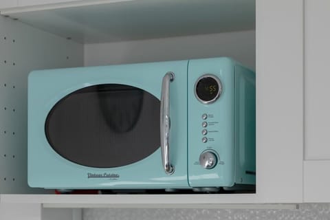 Close-up shots of kitchen appliances and carefully selected decorations that enhance the apartment’s cozy and modern feel.