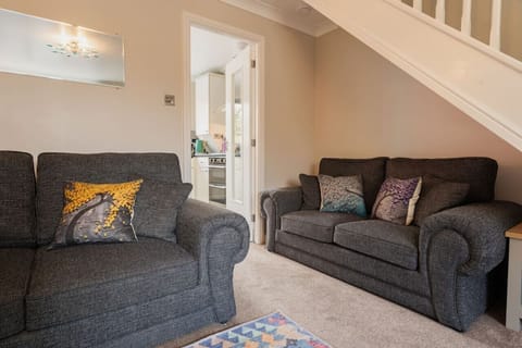 The Living Room: Cosy up on the comfortable sofas in the light & airy living room space.