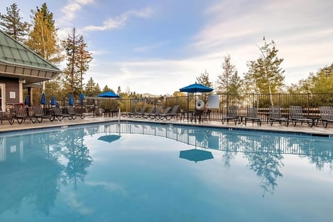 Dive into the sparkling outdoor pool and unwind poolside.