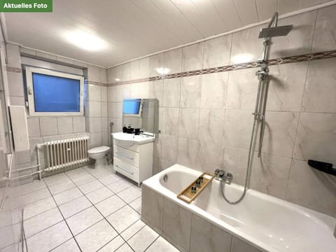 Combined shower/tub, hair dryer, towels, soap