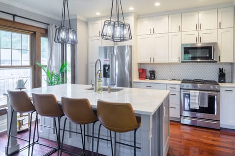 The abundant natural lighting throughout the entire main floor creates a welcoming atmosphere, perfect for hosting family gatherings and friends.