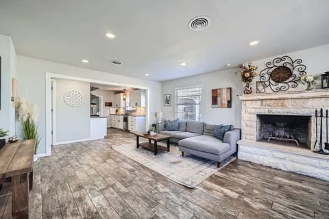 Beautifully integrated living room and dining space designed for comfort and functionality. This cohesive area allows for seamless entertaining and family gatherings, with ample natural light enhancing the ambiance.