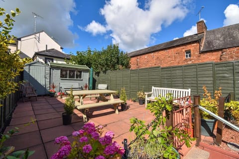 The raised rear garden which is a lovely sun trap and peaceful to relax in.