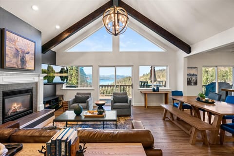 Upon entering Lakeview Pines, you will be greeted by stunning views of Lake Coeur d’Alene and the surrounding mountains, showcased by floor-to-ceiling windows illuminating the western side of the home