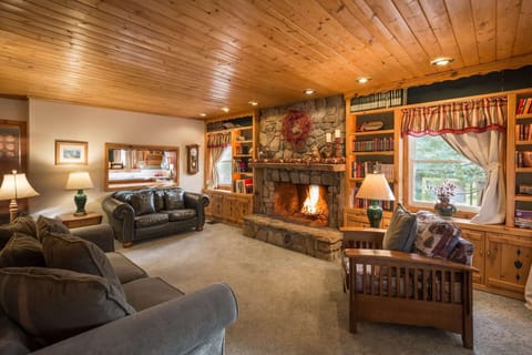 Entry living room with real wood-burning fireplace