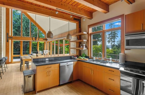 A chef-ready kitchen with forest views—where every meal feels inspired.